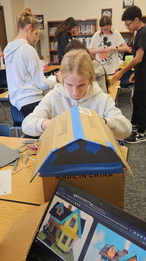 Students in Ms. Gross’ class are wrapping up their Descriptive Writing Unit with a creative culminating activity! Working in pairs, students became real estate agents for Reindeer Realty, writing vivid descriptive paragraphs to “sell” their gingerbread houses.  To bring their writing to life, students designed and built their gingerbread houses using cardboard and other materials, focusing on details that matched their descriptions.  On Friday, 6th and 7th grade students will tour the neighborhood and “purchase” the houses that best match the written descriptions. This engaging project combines creativity, collaboration, and strong writing skills—and it’s been a huge hit! 🎄🏠✏️