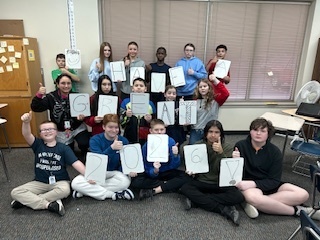 Students holding a message saying, "Have a great 2026!"