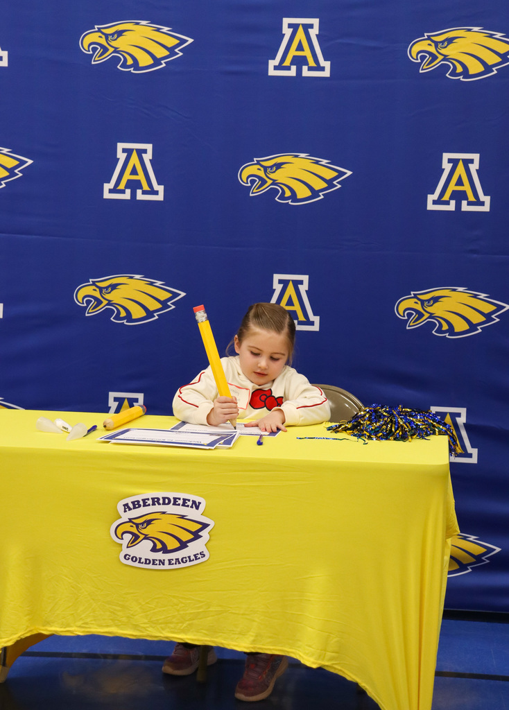 Student at the signing table at Kindergarten Registration Day