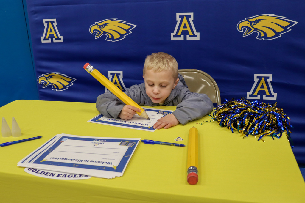 Student at the signing table at Kindergarten Registration Day