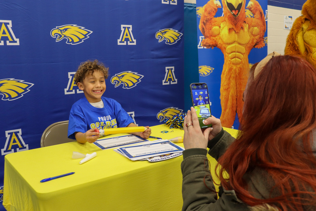 Student at the signing table at Kindergarten Registration Day