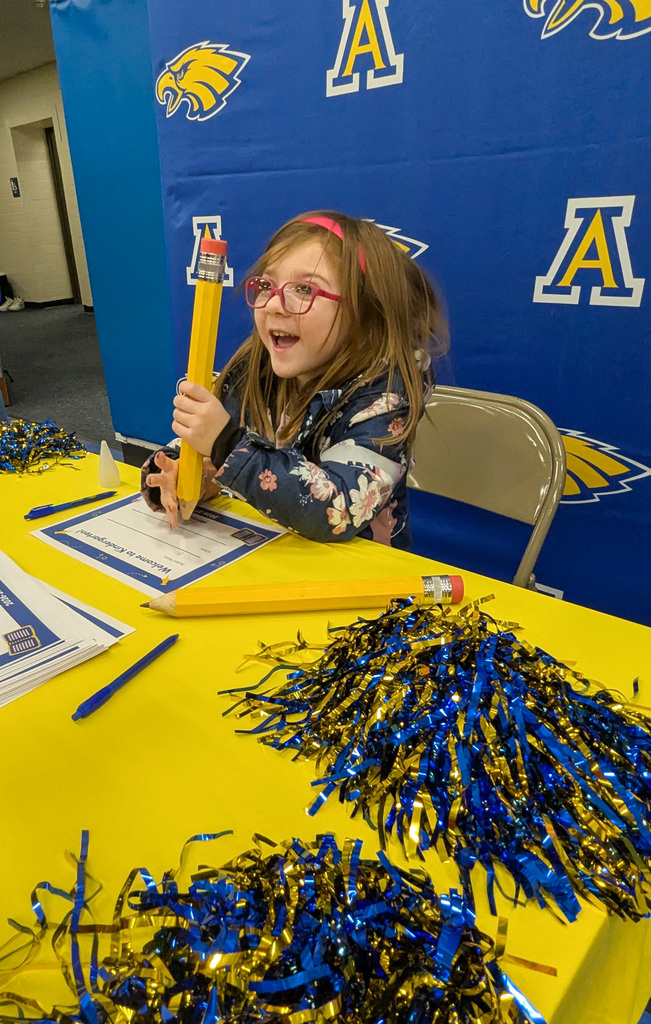 Student at the signing table at Kindergarten Registration Day