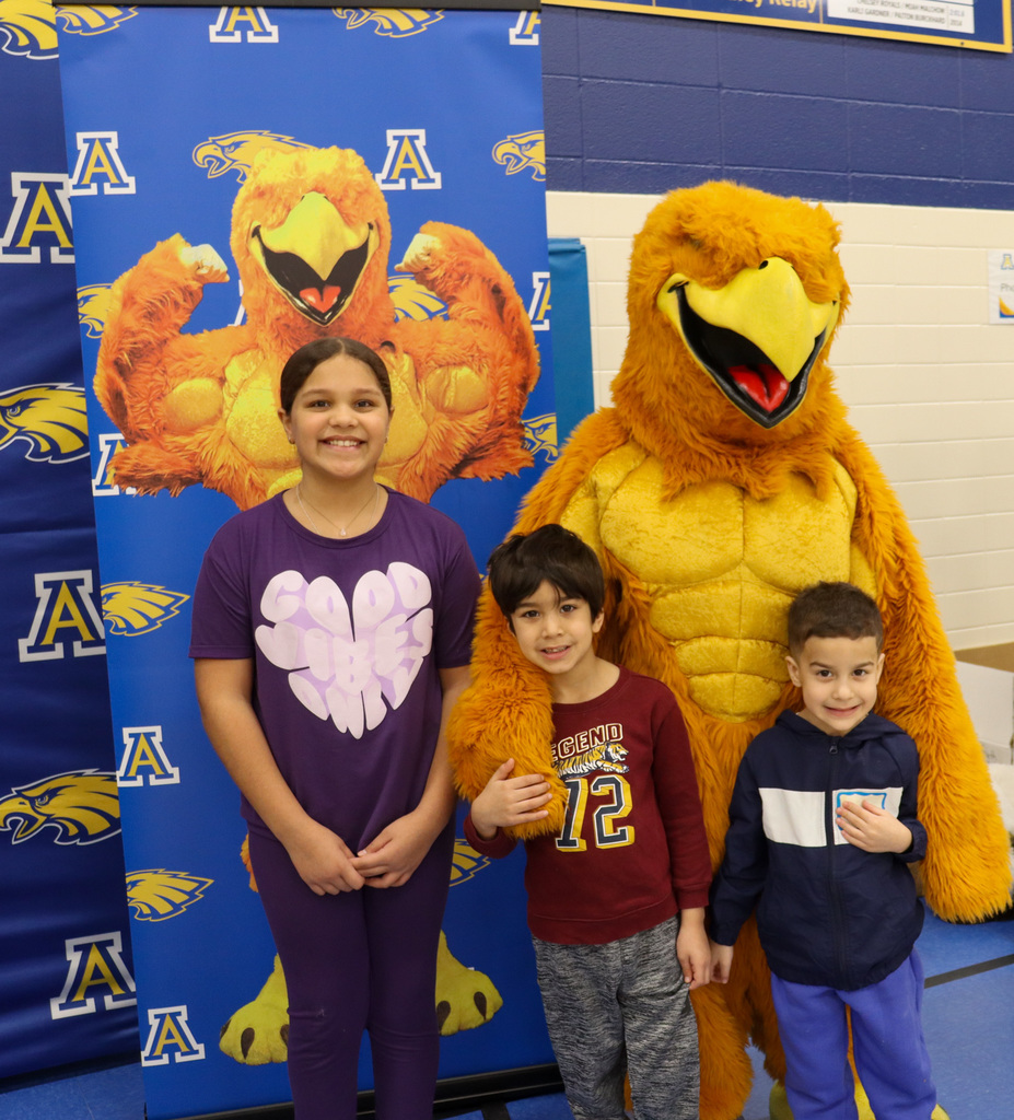 Students taking a picture with the Golden Eagle at Kindergarten Registration Day