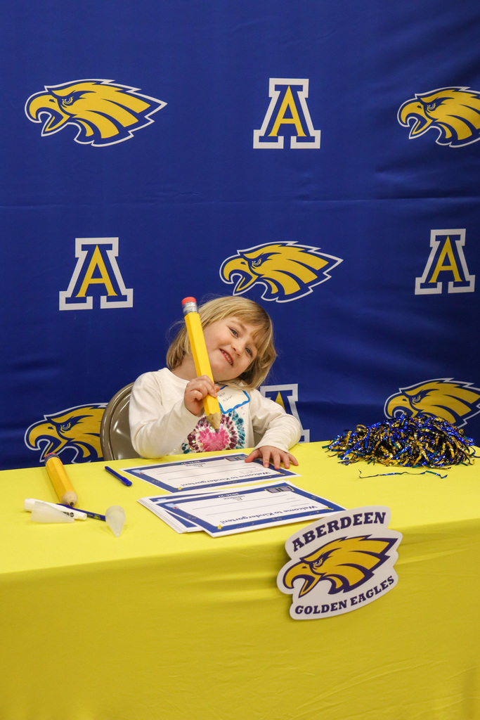 Student at the signing table at Kindergarten Registration Day