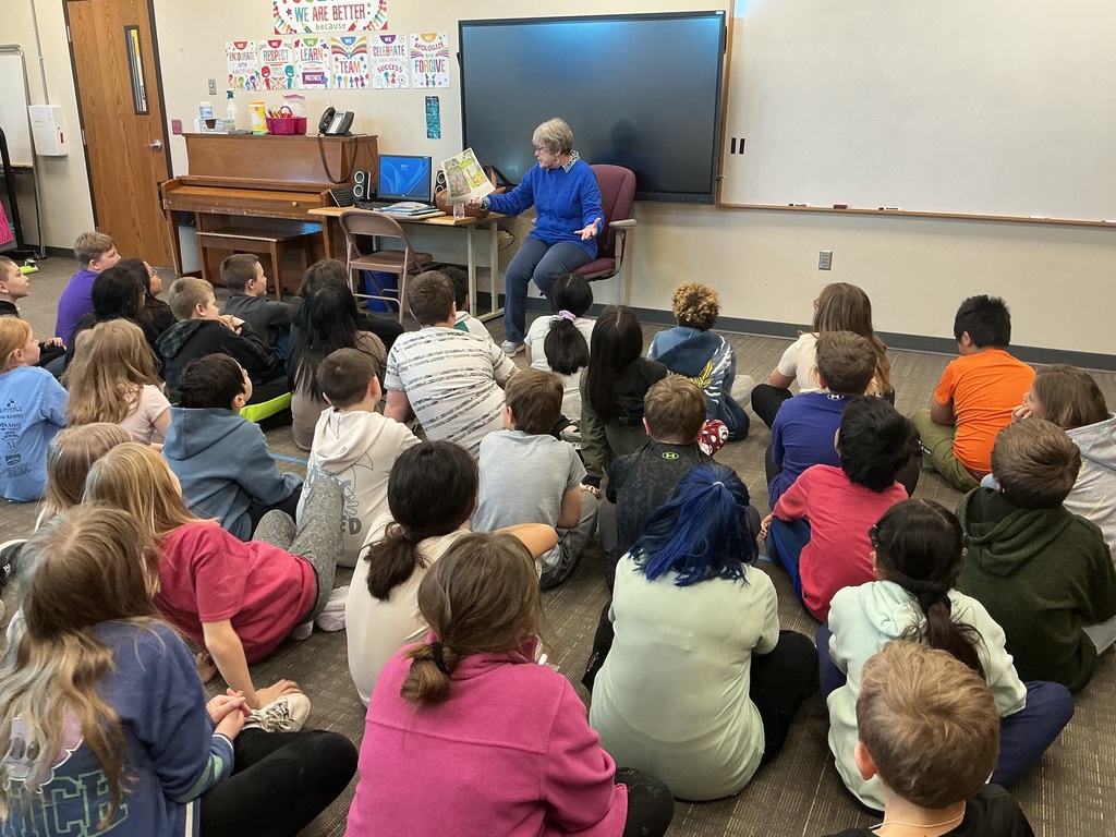 Dr. Bortnem reading to students at Lincoln Elementary