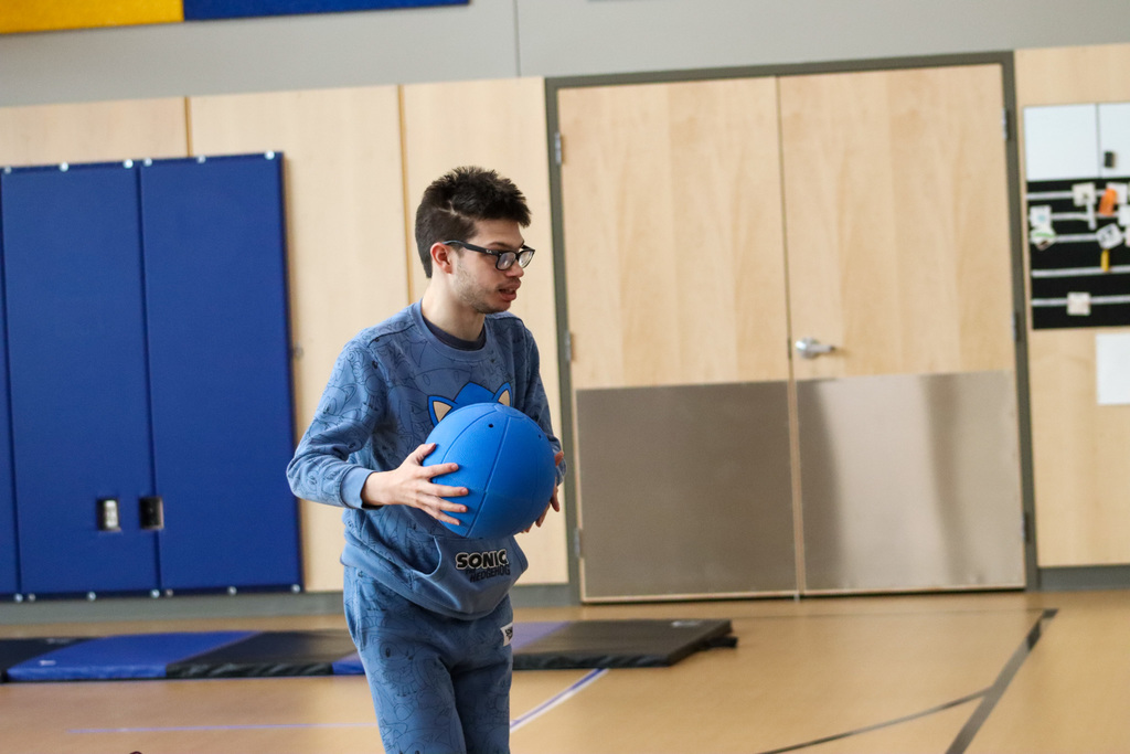 Student  demonstrating Goal Ball at SDSBVI
