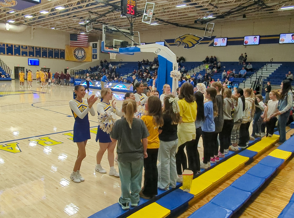 Cheerleaders and O.M. Tiffany students at CHS basketball game