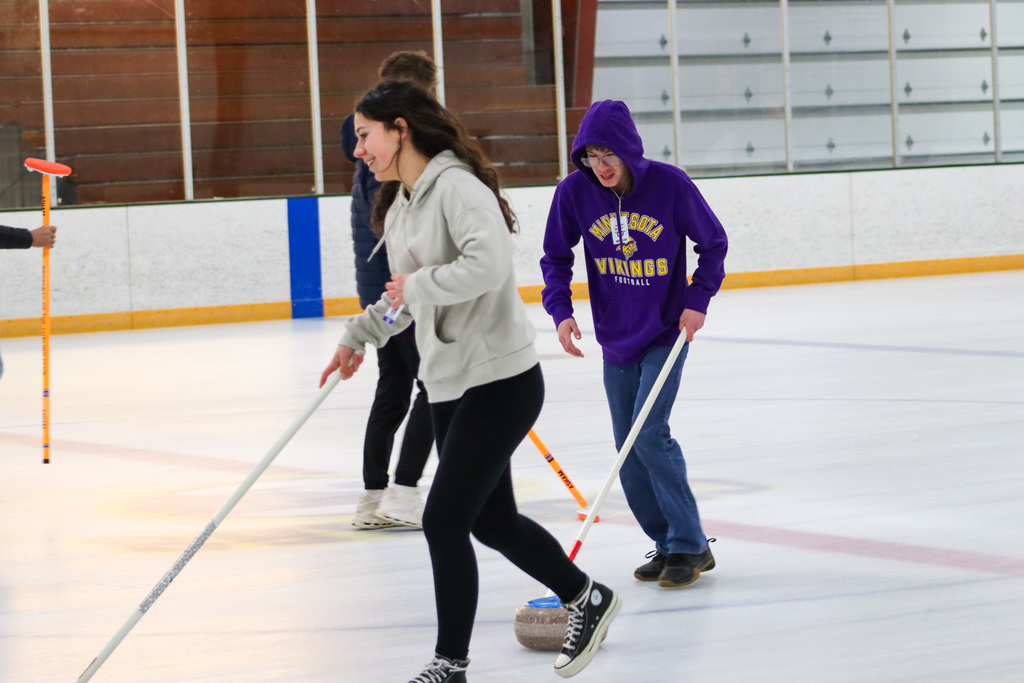 CHS students trying curling with Aberdeen Curling Club members at Odde Ice Arena