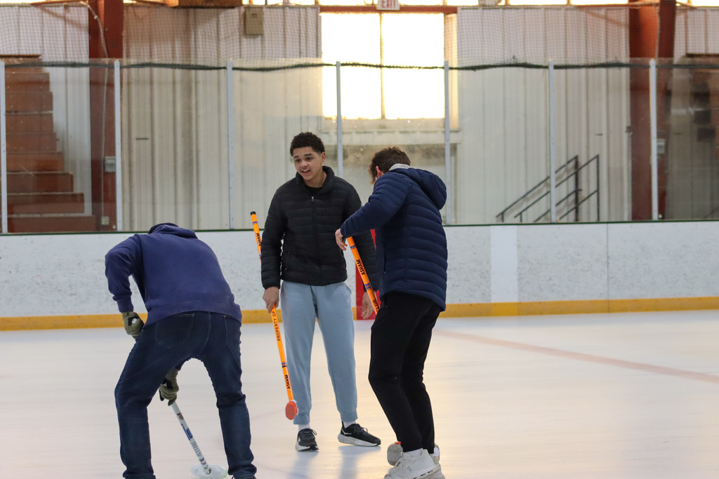 CHS students trying curling with Aberdeen Curling Club members at Odde Ice Arena