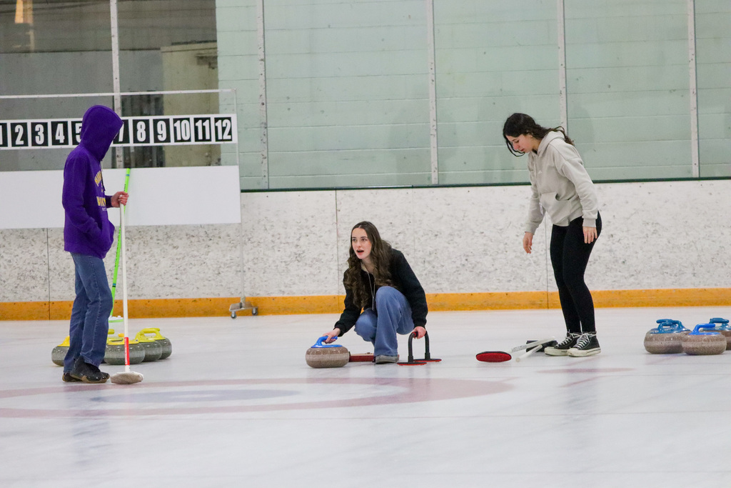 CHS students trying curling with Aberdeen Curling Club members at Odde Ice Arena