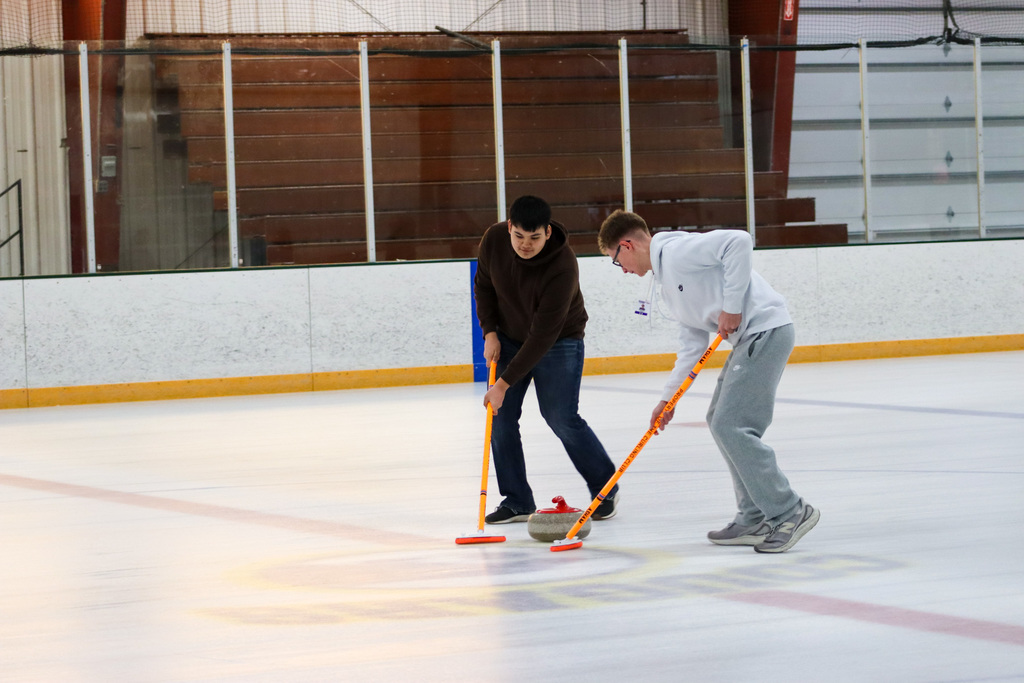 CHS students trying curling with Aberdeen Curling Club members at Odde Ice Arena
