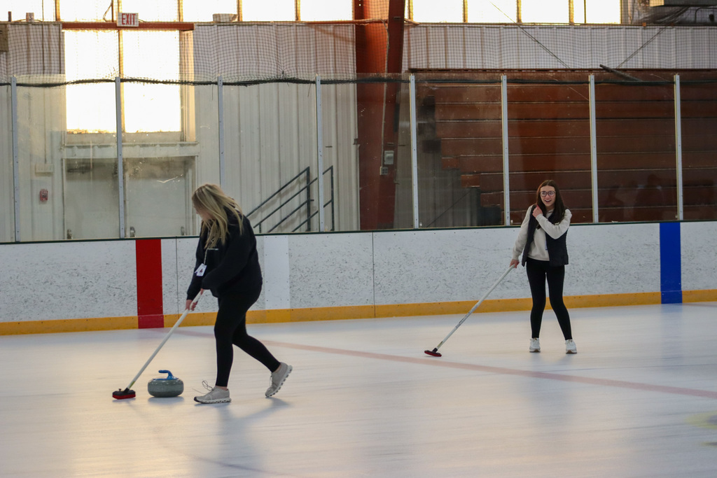 CHS students trying curling with Aberdeen Curling Club members at Odde Ice Arena