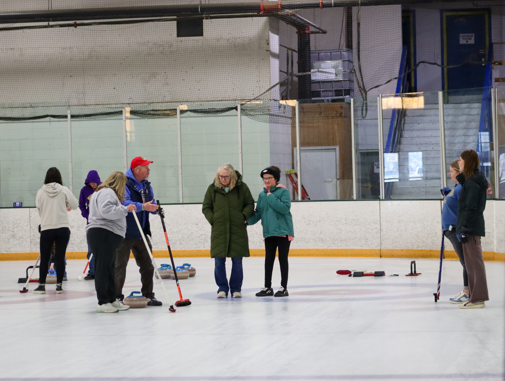 CHS students trying curling with Aberdeen Curling Club members at Odde Ice Arena