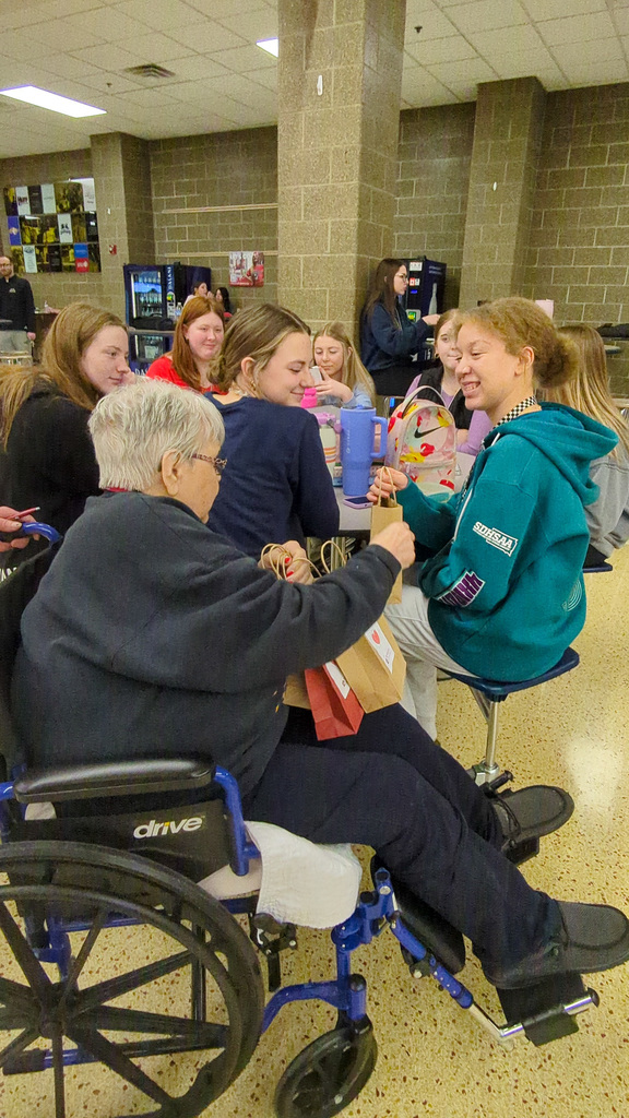 Primrose residents and staff handing out treat bags to CHS students