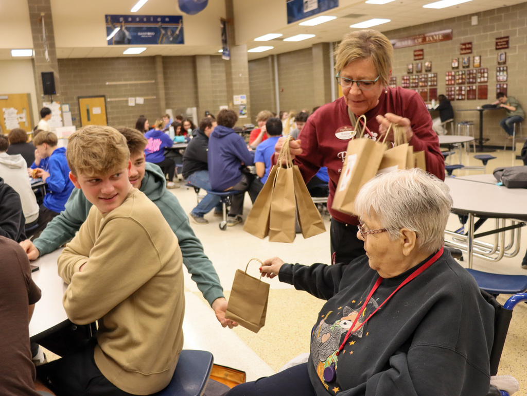 Primrose residents and staff handing out treat bags to CHS students