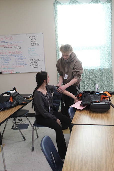 ATEC EMT students practicing vitals on other students