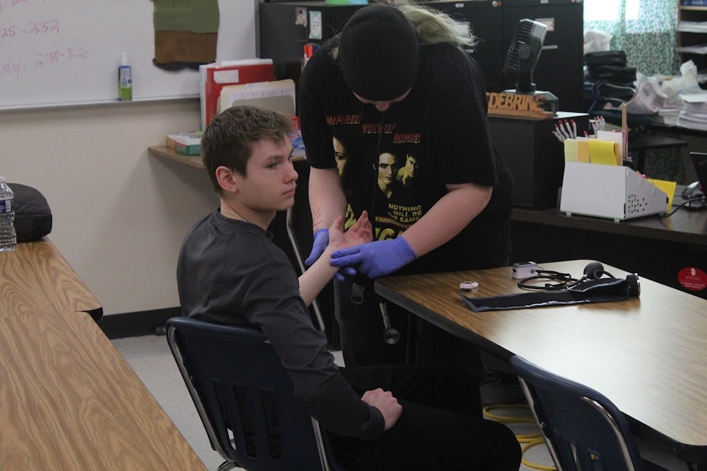 ATEC EMT students practicing vitals on other students