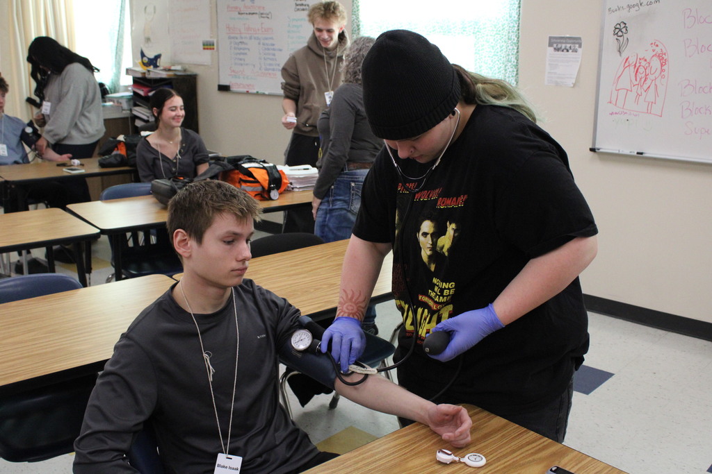 ATEC EMT students practicing vitals on other students
