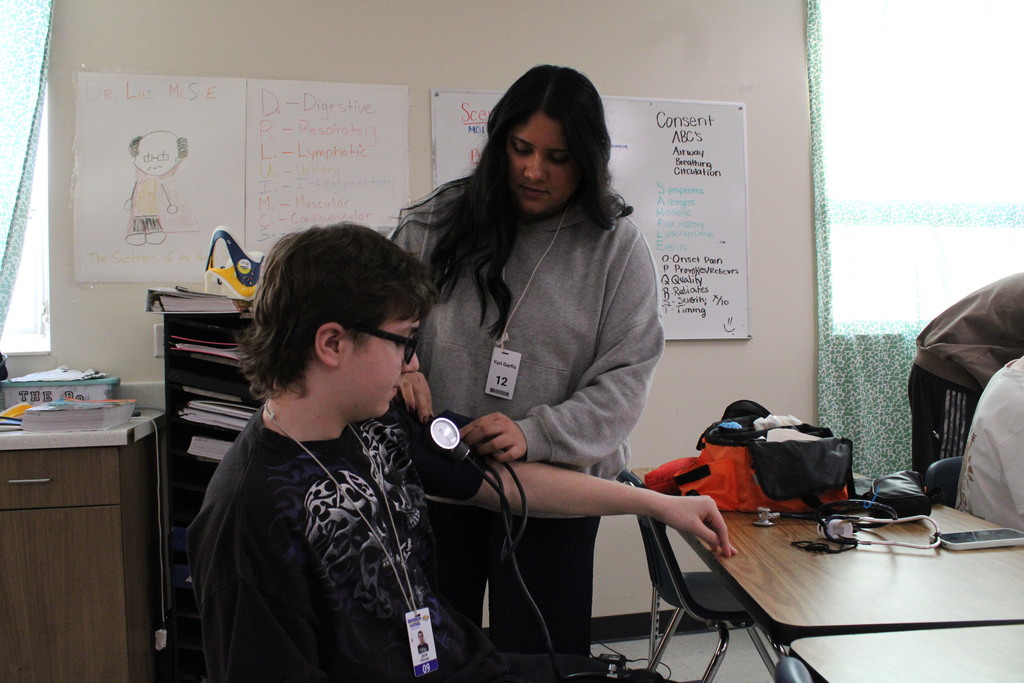 ATEC EMT students practicing vitals on other students