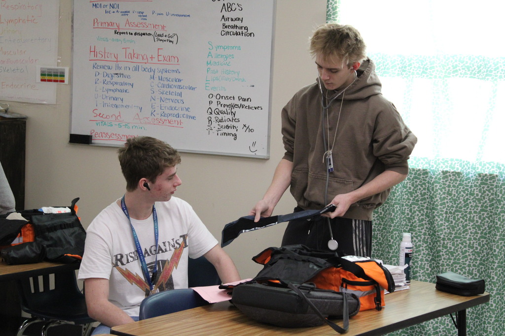 ATEC EMT students practicing vitals on other students