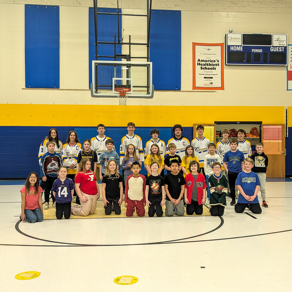 C.C. Lee students with Aberdeen Cougar Hockey players