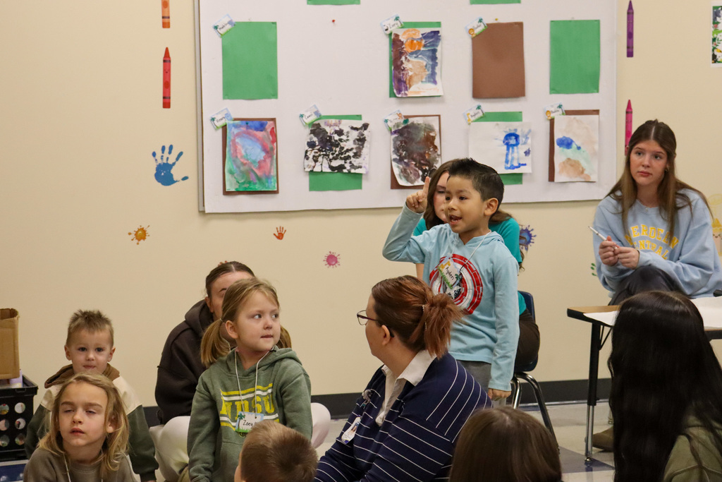 CHS students and teacher and children at Little Eagles Preschool