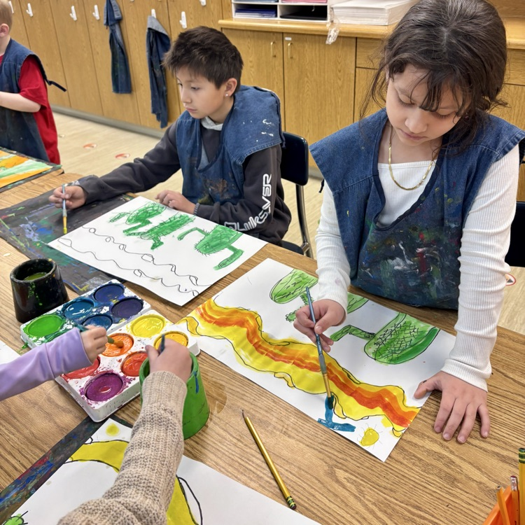 First-graders work on their desert paintings.