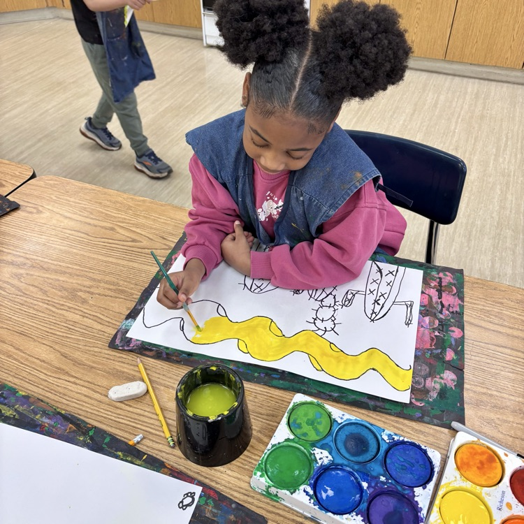 First-graders work on their desert paintings.