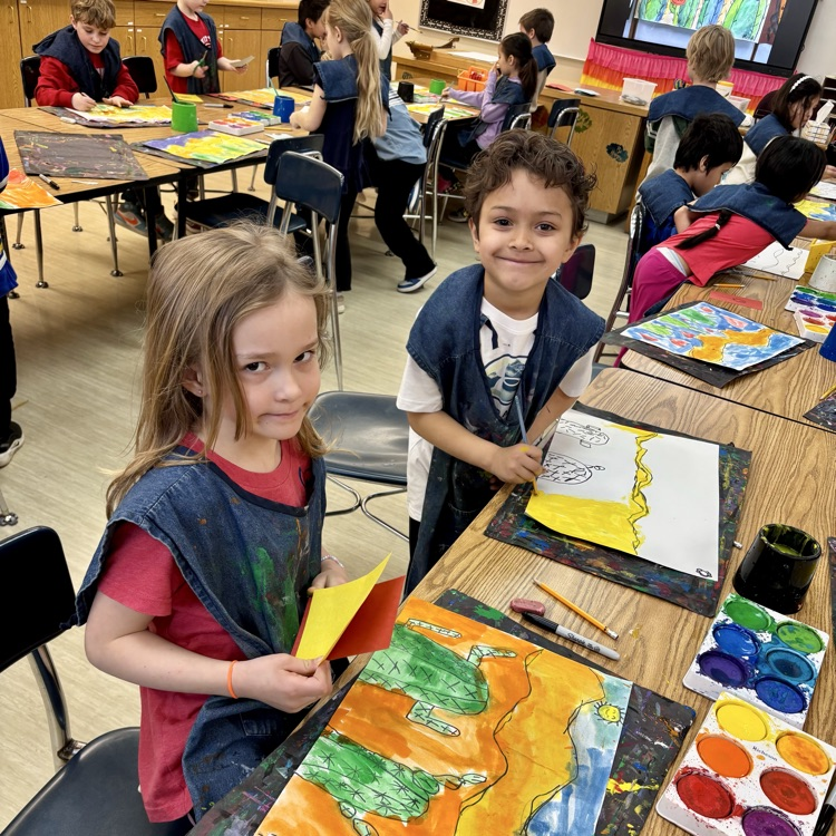 First-graders work on their desert paintings.
