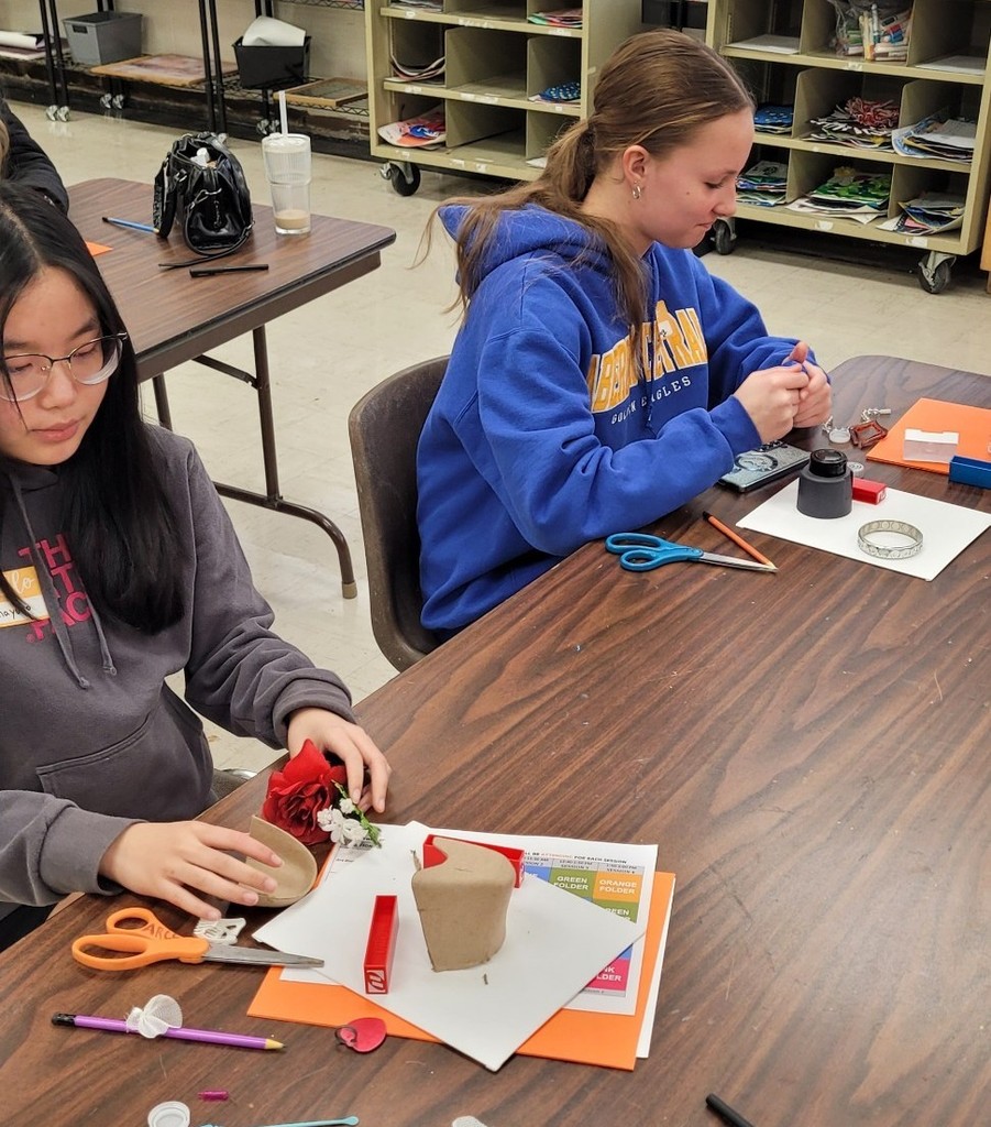 Assembling a sculpture.