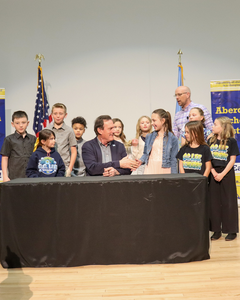 Gov. Rhoden shaking the hand of a C.C. Lee student