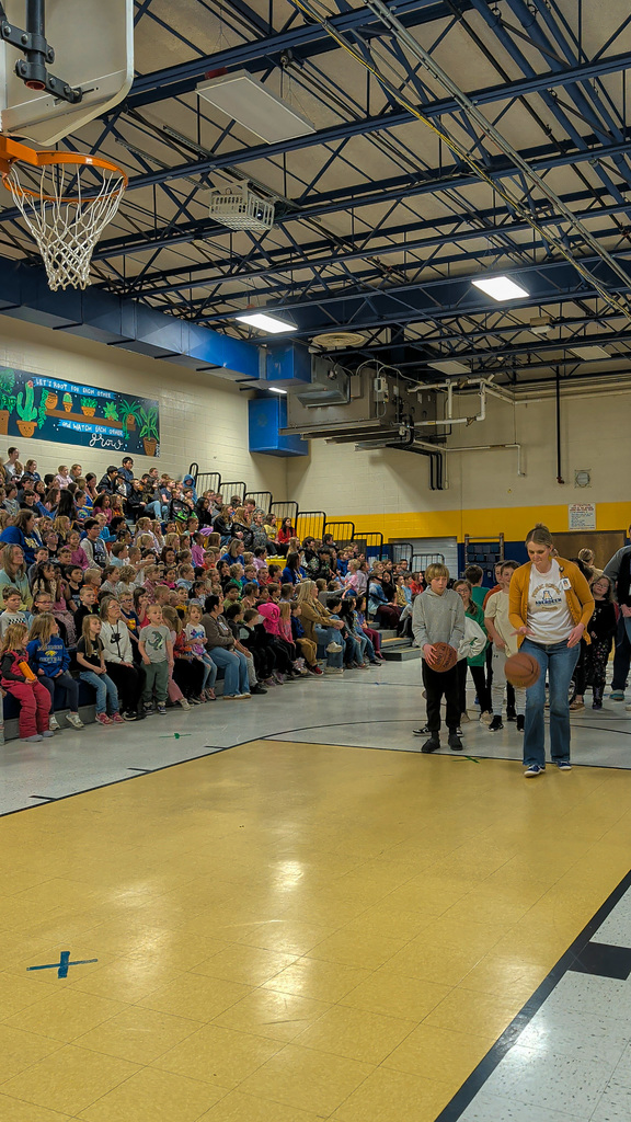 O.M. Tiffany students and teachers playing a basketball game