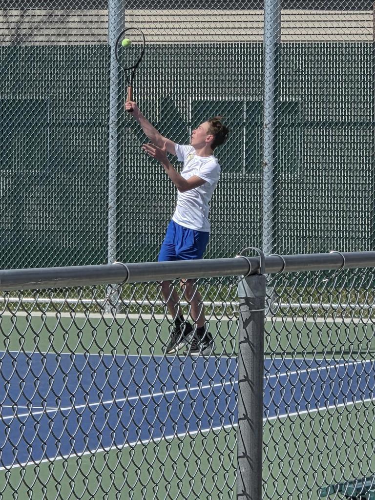CHS Tennis Player playing at Huron Meet