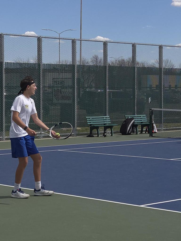 CHS Tennis Player playing at Huron Meet