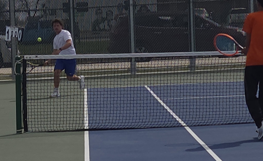 CHS Tennis Player playing at Huron Meet