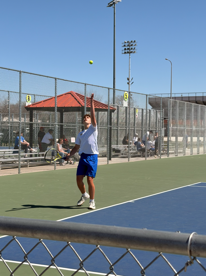 CHS Tennis Player playing at Huron Meet