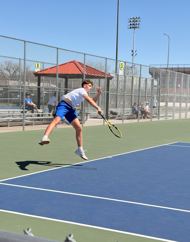 CHS Tennis Player playing at Huron Meet