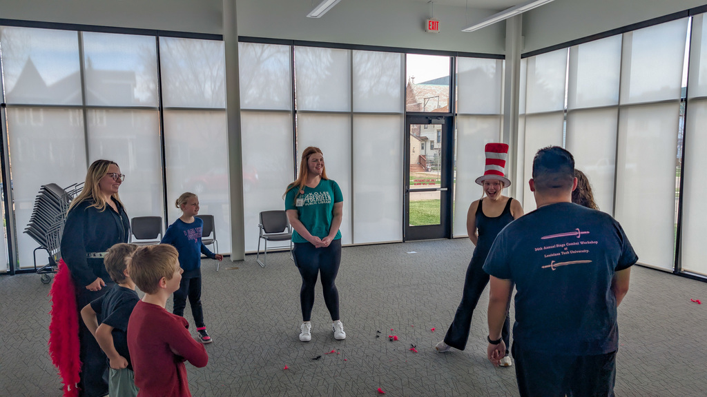 CHS actors helping students at an acting workshop at the library