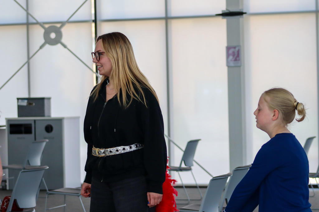 CHS actors helping students at an acting workshop at the library