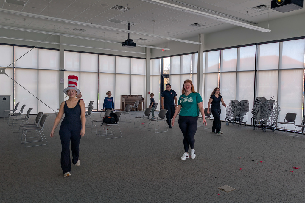 CHS actors helping students at an acting workshop at the library