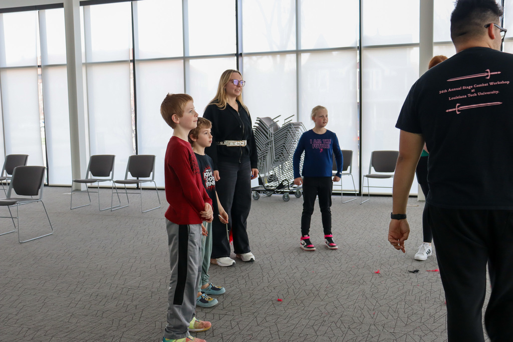 CHS actors helping students at an acting workshop at the library