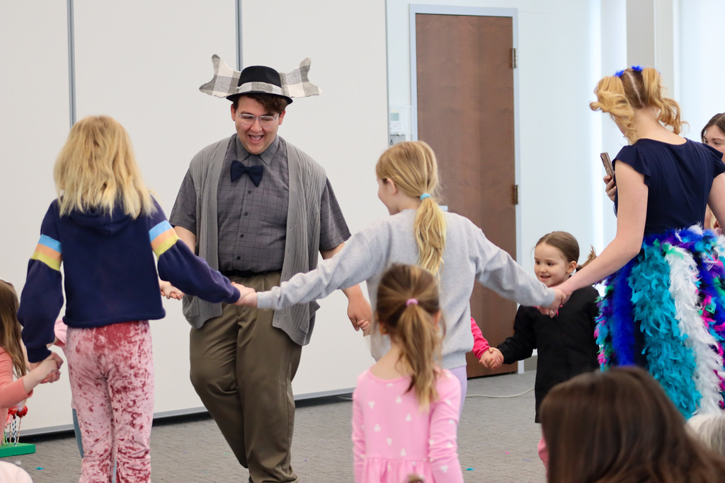CHS students Joey Johnson and Elsa Schiferl with kids at K.O. Lee Library's Saturday storytime.