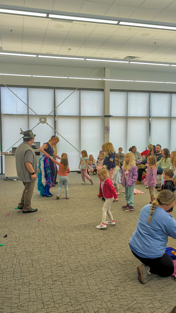 CHS students Joey Johnson and Elsa Schiferl with kids at K.O. Lee Library's Saturday storytime.