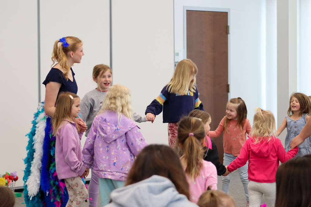 CHS students Joey Johnson and Elsa Schiferl with kids at K.O. Lee Library's Saturday storytime.