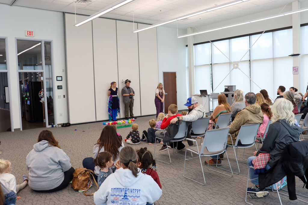 CHS students Joey Johnson and Elsa Schiferl with kids at K.O. Lee Library's Saturday storytime.