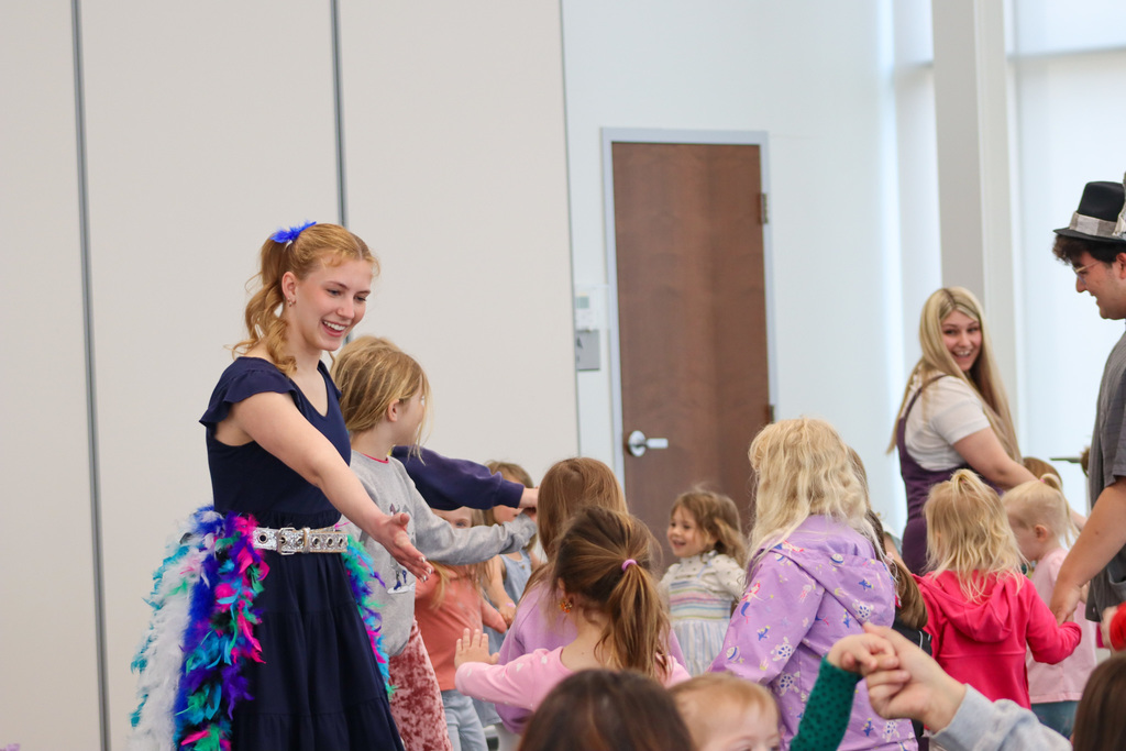 CHS students Joey Johnson and Elsa Schiferl with kids at K.O. Lee Library's Saturday storytime.