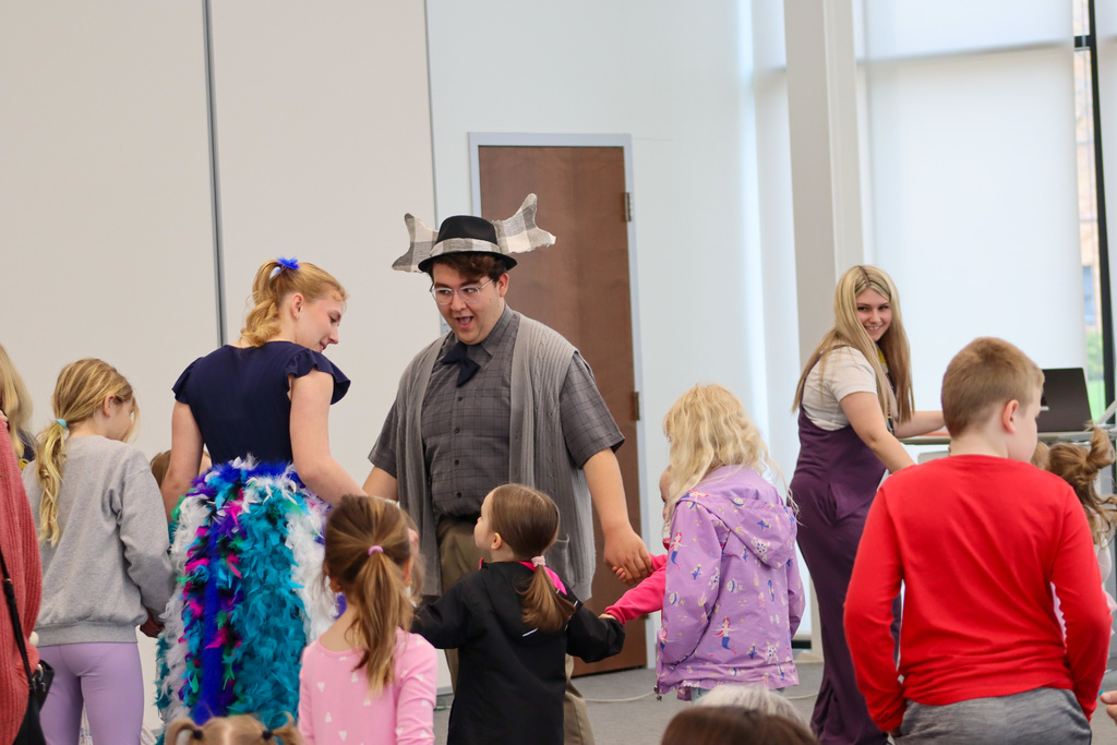 CHS students Joey Johnson and Elsa Schiferl with kids at K.O. Lee Library's Saturday storytime.
