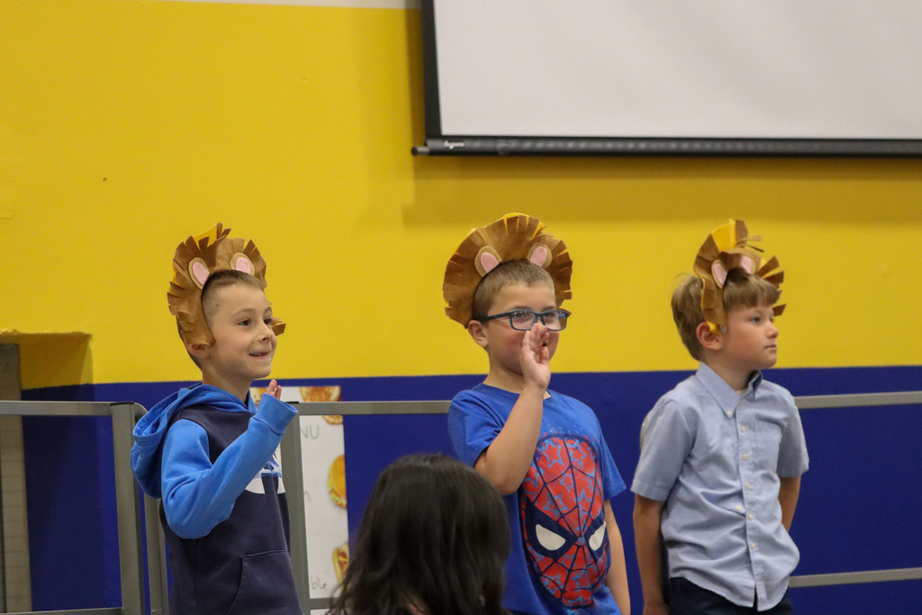 Mike Miller students waving during their spring program