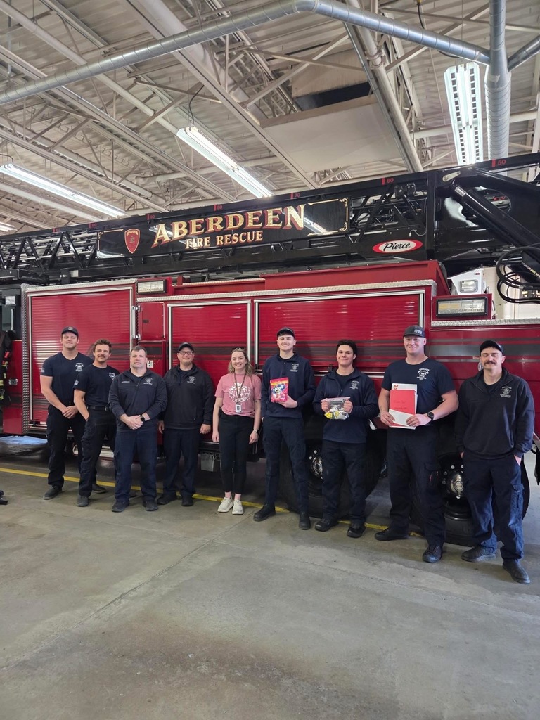 Ms. Bierne dropping off donation to AFD