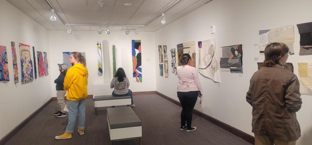 CHS ART CLUB students are looking at a textile art exhibit during the Art club field trip last Friday, May 1st!